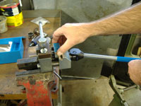 lining up the punch in the brake line flaring tool