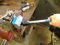 pressing the flare in the brake line flaring tool